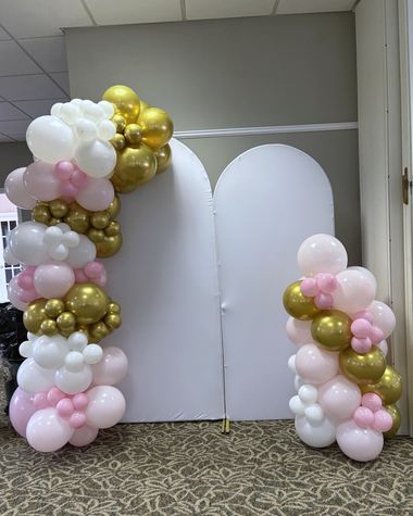 Blush, ivory and chrome gold across twin arch panels, built by Sherri's Heavenly Balloons in central Indiana.