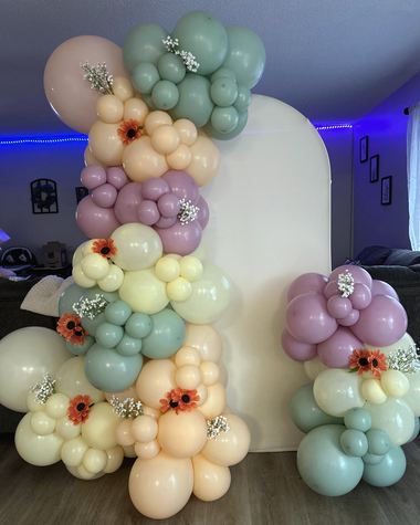 Sage, lilac and peach garland with dried florals, built by Sherri's Heavenly Balloons in central Indiana.