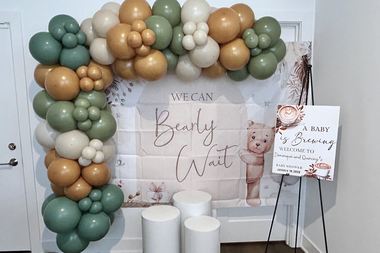 Sage, rust and cream garland across a lettered backdrop, built by Sherri's Heavenly Balloons in central Indiana.
