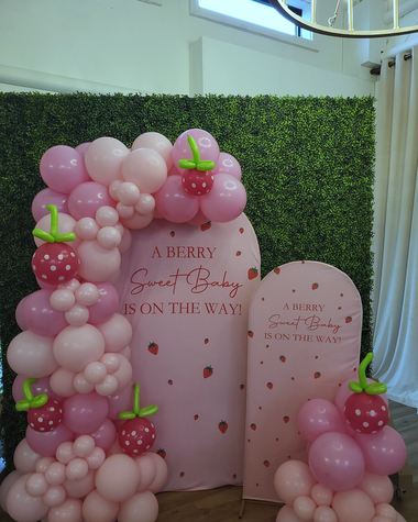Rose and blush garland across a greenery wall, built by Sherri's Heavenly Balloons in central Indiana.