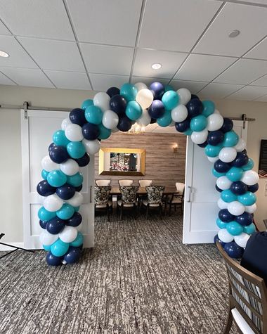 Teal, navy and pearl arch set into a doorway, built by Sherri's Heavenly Balloons in central Indiana.