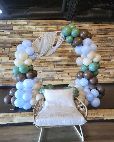 Dusty blue, mocha and cream arch on a wood slat wall, built by Sherri's Heavenly Balloons in central Indiana.